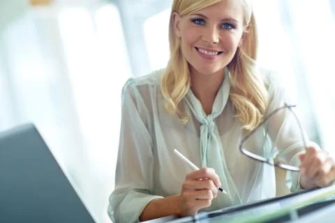 She improves office morale with her smile. Portrait of a beautiful corporate Stock Photos