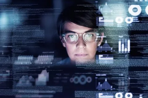 She knows code. Cropped shot of a young computer programmer looking through data Stock Photos