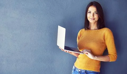 She knows how to network with people. Portrait of a young woman standing against 스톡 사진