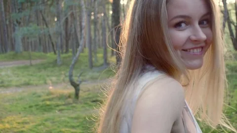 She leads by the hand through the forest Stock Footage 72524112