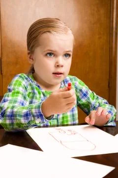 She is looking up from her masterpiece Stockfoto's