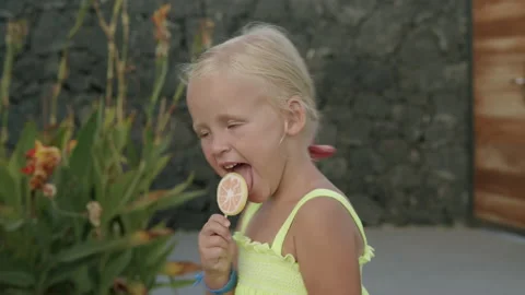 She loves sweets and having fun Stock Footage 142406732