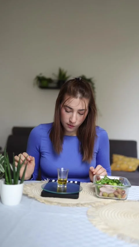 She measures every calorie before eating Stock Footage 339855113