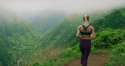 She is at one with nature on her run Stock Footage 100783962