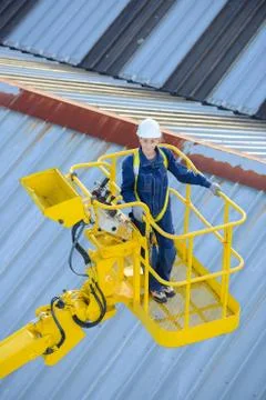 She is operating a truck elevator Stock Photos