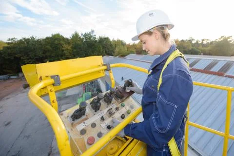 She is operation the platform Stock Photos