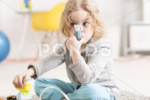 She prefers to play rather than taking her medicine Stock Photos