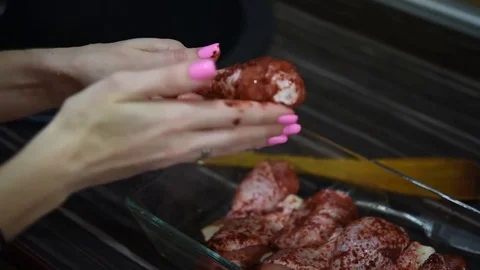 She prepares chicken thighs Stock Footage 73833755