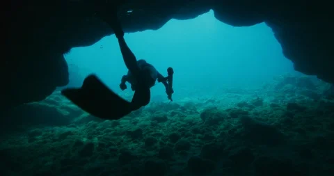 She returns to the world from an exquisite underwater cave Stock Footage 100791369