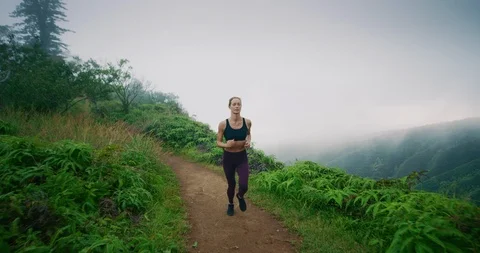 She runs contently, surrounded by beauty Stock Footage 100788981