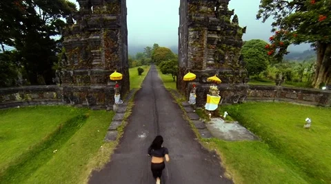 She runs through the gate Stock Footage 62342819