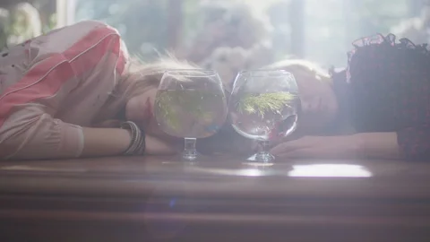 She sat and talked at the table by the window. Stock Footage 128871531