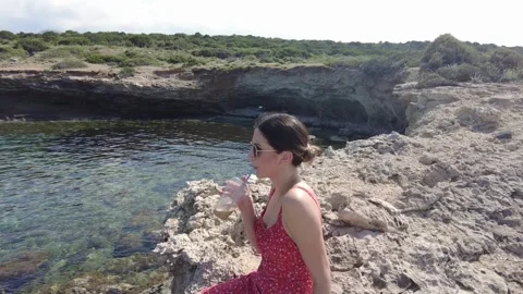 She sips her coffee while watching the magnificent view. Stock Footage 278104943
