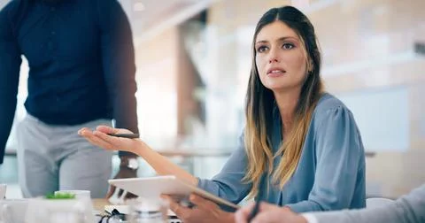 She speaks with experience and knowledge. an attractive young businesswoman Stock Photos