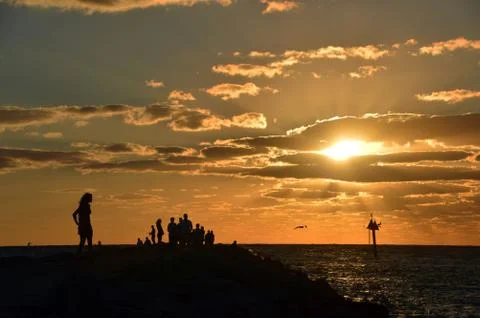 She stands alone at sunset Stock Photos
