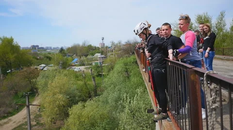 She thinks long and can not be disengaged from the fear of the jump Stock Footage 68351432