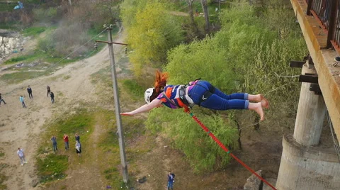 She thinks long before the jump, and then the instructor pushes her Stock Footage 68349850