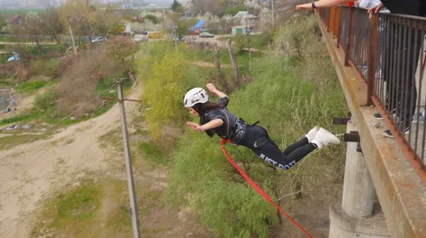 She thinks long before the jump, and then the instructor pushes her Stock Footage 68350490
