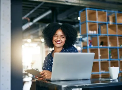 She uses technology to her advantage. a young female designer working in her Stock Photos