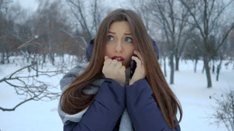 She warms his hands at winter standing in the snow. Full hd video Stock Footage 101104506
