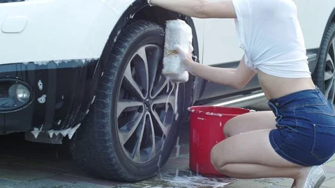 She washes the wheel Stock Footage 72700016