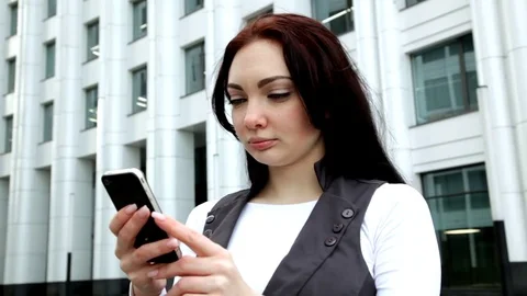 She works with the phone Stock Footage 73088962