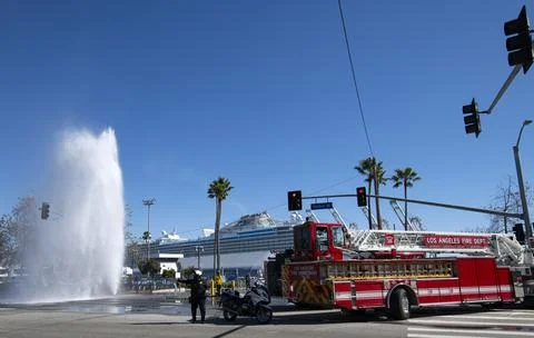 Sheared off fire hydrant water streaming shooting high in the sky first respond Stock Photos