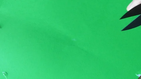 Shears in hand on screen green background, 스톡 동영상 94618969