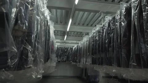 Sheathed clothes in the warehouse slider shot Stock Footage 138014136