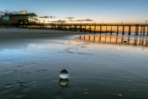 Sheen on the sand makes double. Stock Photos
