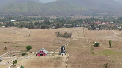 A Sheep Barn and a Windmill in Northern Thailand Stock Footage 156481771