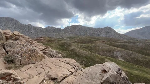 Sheep Herd Moving Across Mountain Hillside Landscape Stock Footage 343831140