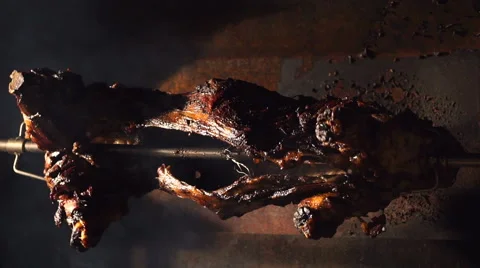 Sheep on spits roasting Stock Footage 61770956