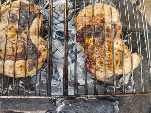 Sheep testicles on the barbecue Stock Photos
