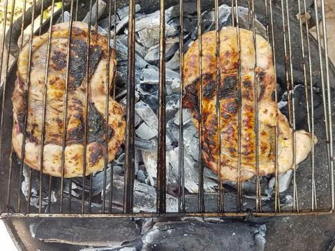 Sheep testicles on the grill Stock Photos