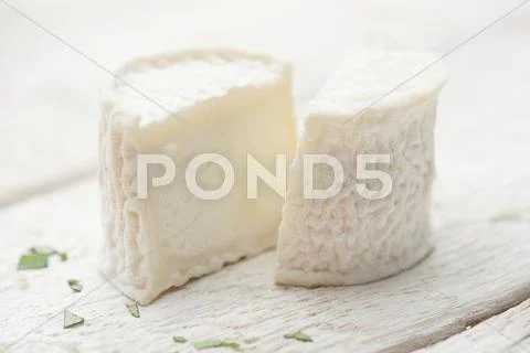 Sheep's cheese, halved Stock Photos