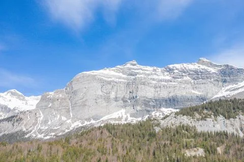 Sheer cliffs of Pointe de Plate under spring sky Stock Photos