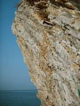 Sheer cliffs into the sea 스톡 사진
