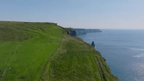 Sheer Grass Edge Above Cliffs of Moher Coastline, Ireland Aerial Fly Along Stock Footage 341477488