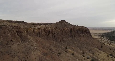 Sheer rock faces on top of mountain, dramatic orange rock drone aerial 4K Stock Footage 111316210