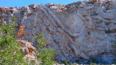 A sheer surface in the mountains, on which layers of the earth's crust  Stock-Footage 104077355