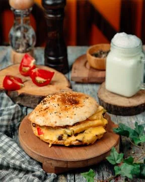 Сheeseburger with lots of melted cheese Stock Photos