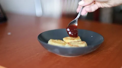 Сheesecakes with raspberry jam Stock Footage 204014916