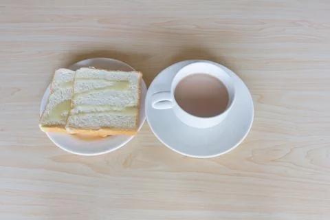 Sheet bread and a cup of coffee on table Stock Photos