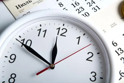 Sheet of a calendar with clockface Stock Photos