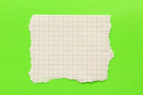 A sheet of checkered paper with uneven torn edges, empty and without text, .. Stock Photos