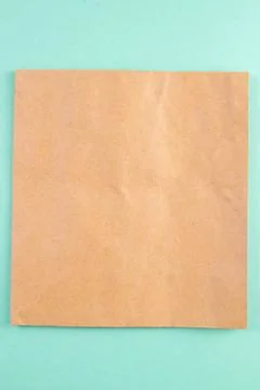 A sheet of craft paper on a mint background Stock Photos