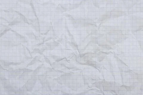 A sheet of crumpled notebook sheet in a checkered close-up. Background, texture. Stock Photos