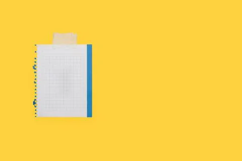 A sheet of graph paper on a yellow background 스톡 사진