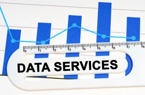 On the sheet with graphs there is a white ruler with the inscription - DATA S Stock Photos